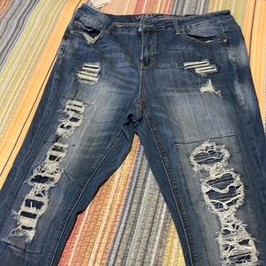 Distressed mid rise skinny jeans